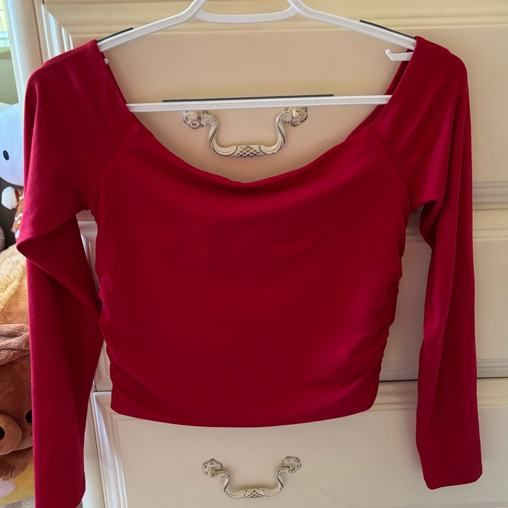 Red off the shoulder top/cinched on sides/ size medium.